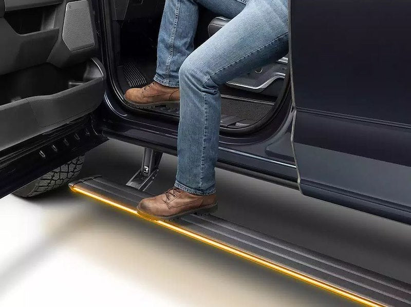 Amp Research Vision Power Running Boards 96255-01A PowerStep™ Vision; Textured Powder Coated; Matte Black; Cast Aluminum; With Remote Operated LED Light System; Rocker Panel Mount; 600 Pound Load Capacity